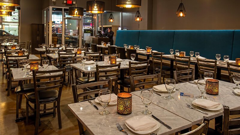 Interior dining room with set tables and booth seating